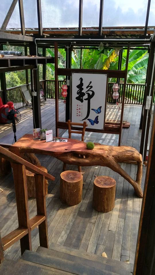 Handcrafted timber table and log stools inside the farmstay
